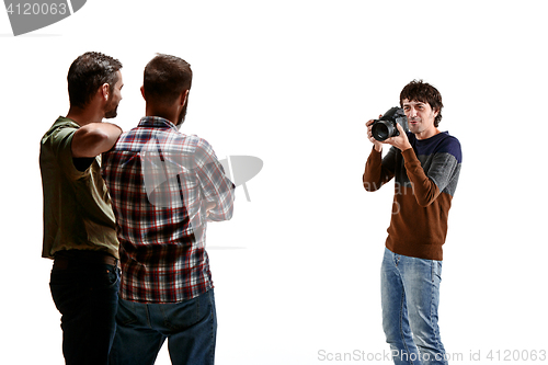Image of Friends with camera on white