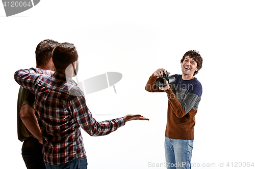 Image of Friends with camera on white