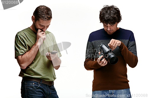 Image of Friends with camera and phone on white