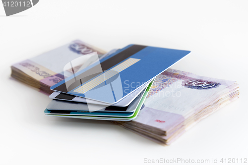 Image of Bank cards in hand on the background of banknote