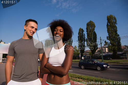 Image of Portrait of romantic pretty couple on fitness session, outside t