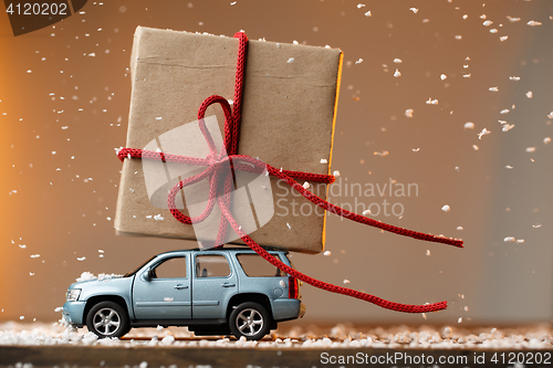 Image of Card with machine carrying gift