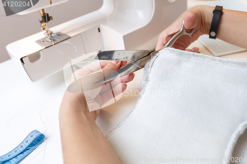 Image of Sewing machine with woman close-up