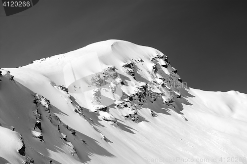 Image of Black and white view on off-piste slope in winter mountains afte