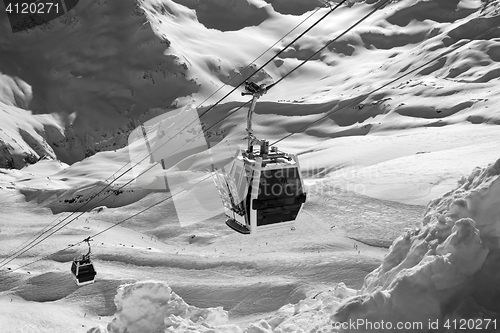 Image of Black and white view on ski lift in snow mountains