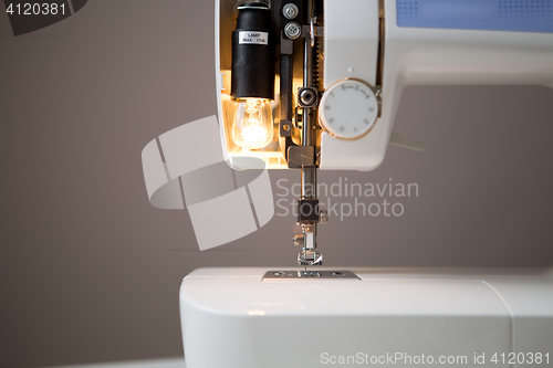 Image of Sewing machine with open lamp