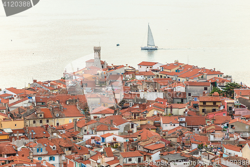 Image of Rooftops of Piran townwith a bright blue sea in the background, Slovenia.