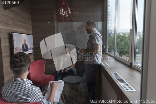 Image of start up business people group attending videoconference call