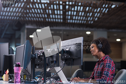 Image of young black woman at her workplace in modern office  African-Ame