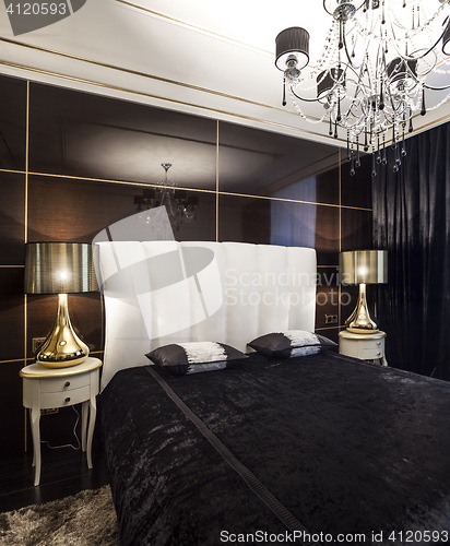 Image of  Luxury bedroom interior with golden lights