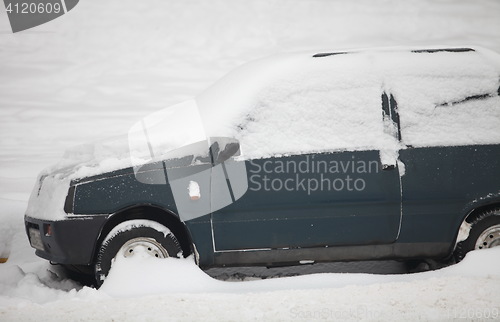 Image of  small car under snow