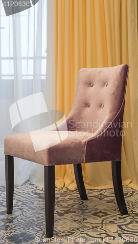 Image of elegant chair with fabric upholstery