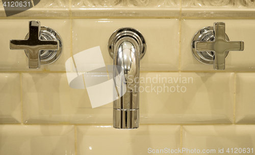 Image of Water tap mounted in the wall