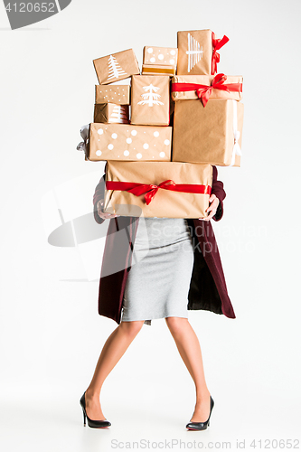 Image of Gift boxes in the hands of young woman