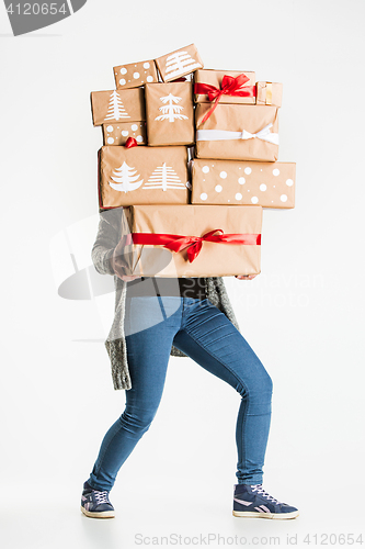 Image of Gift boxes in the hands of young woman