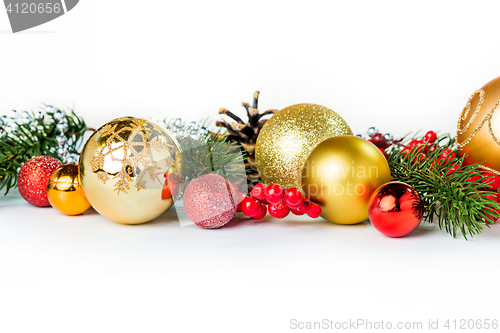 Image of Gold Christmas balls on white