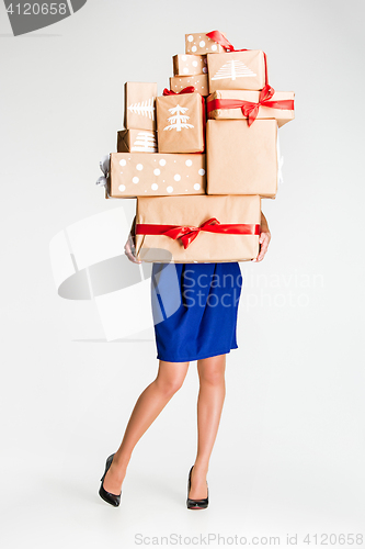 Image of Gift boxes in the hands of young woman