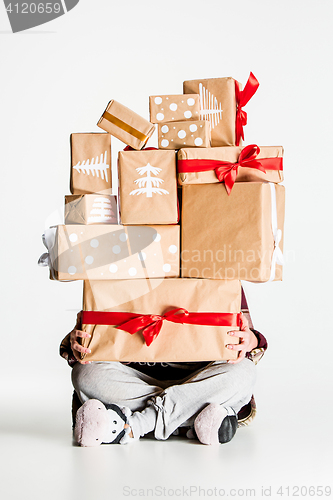 Image of Gift boxes in the hands of young woman