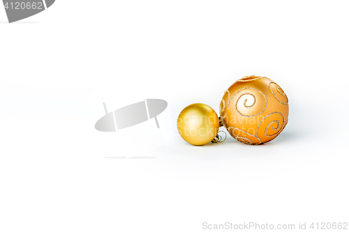 Image of Gold Christmas balls on white