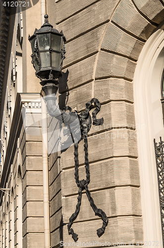 Image of Antique forged lantern on the wall of a building in Riga