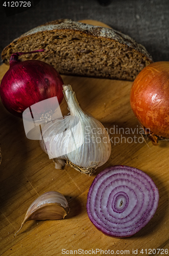 Image of Still life with homemade bread and vegetables