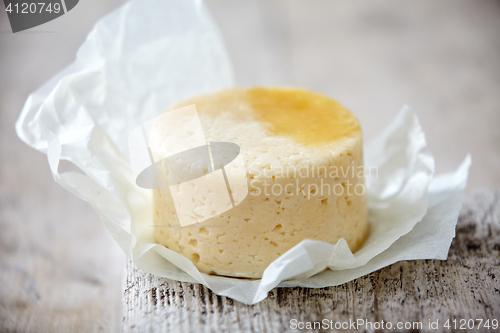 Image of fresh cheese on wooden table