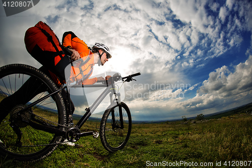 Image of Young man is riding bicycle outside. Healthy Lifestyle.