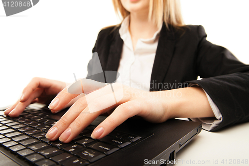 Image of Woman hands typing on laptot, close-up, isolated