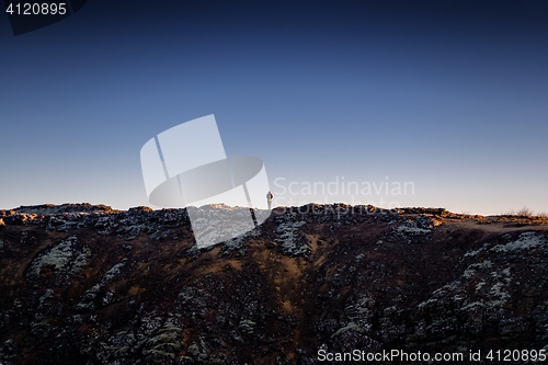 Image of Landscape with mountains and small man