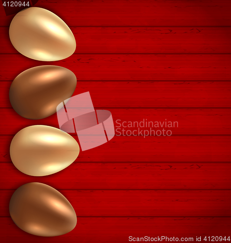 Image of Easter chocolate and golden eggs on red wooden background