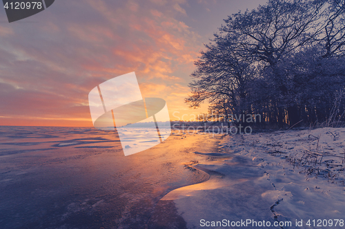 Image of Frozen lake scenery in the sunrise