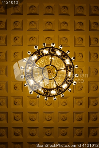 Image of Chandelier on decoarted ceiling