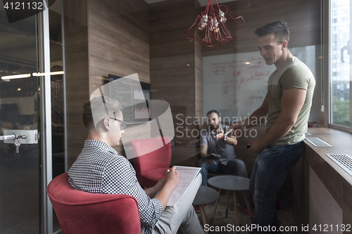 Image of team meeting and brainstorming in small private office