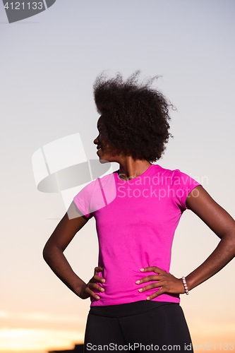 Image of Portrait of a young african american woman running outdoors