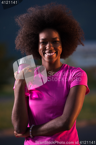 Image of Portrait of a young african american woman running outdoors