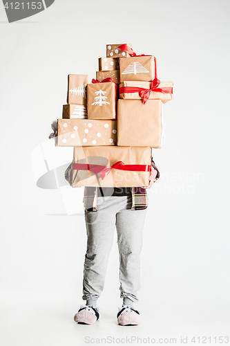 Image of Gift boxes in the hands of young woman