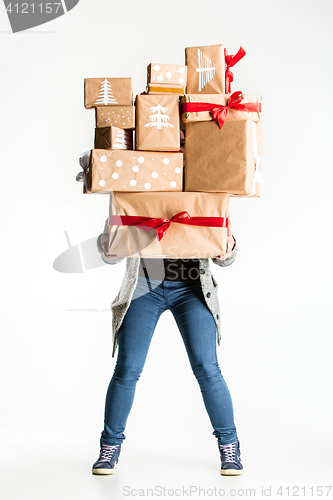 Image of Gift boxes in the hands of young woman