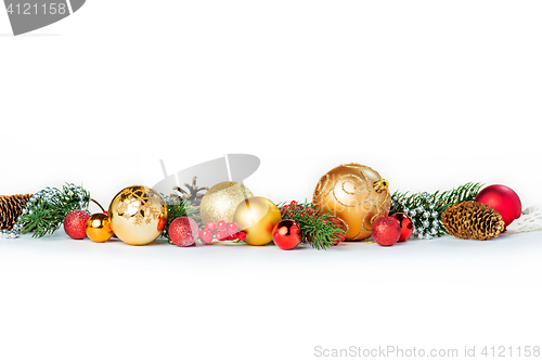 Image of Gold Christmas balls on white