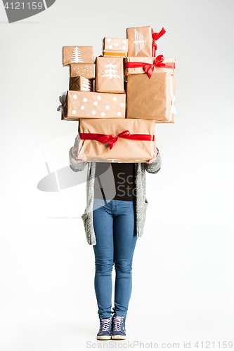 Image of Gift boxes in the hands of young woman