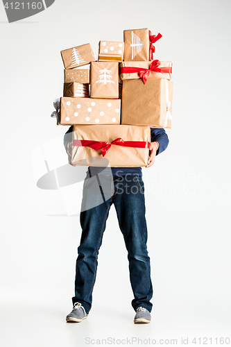 Image of Gift boxes in the hands of young man
