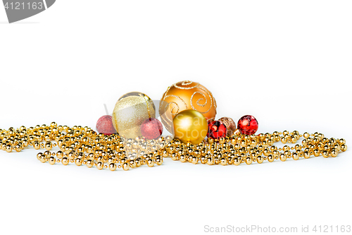Image of Gold Christmas balls on white