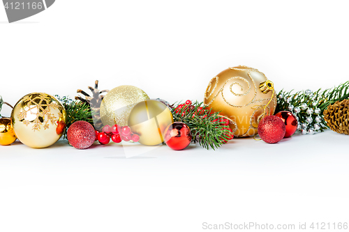 Image of Gold Christmas balls on white