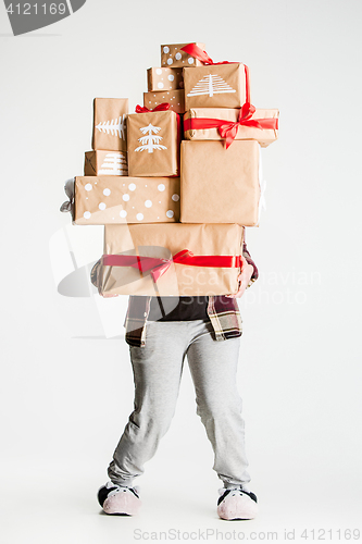 Image of Gift boxes in the hands of young woman