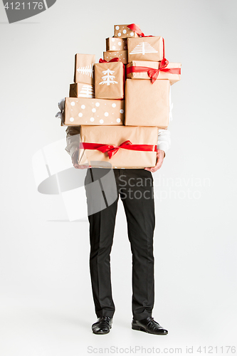 Image of Gift boxes in the hands of young man