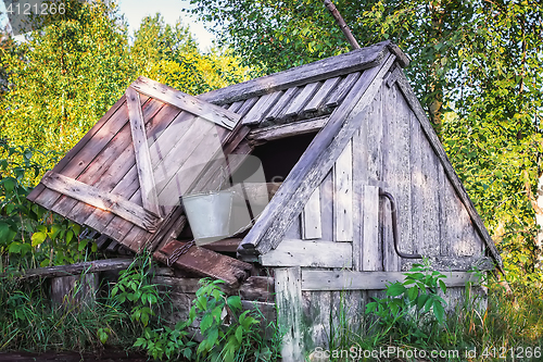 Image of Old Wooden Well With A Bucket