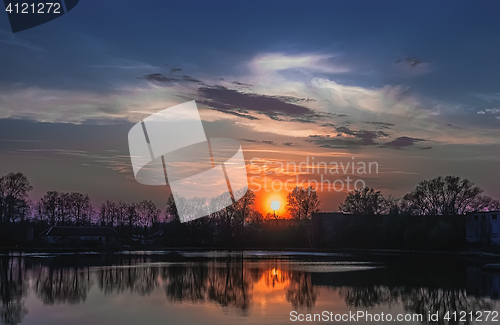 Image of Setting Sun Over The Lake