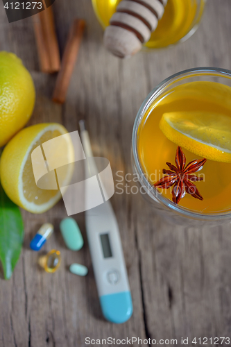 Image of Hot lemon tea and pills 