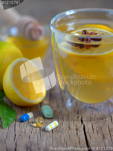 Image of Hot lemon tea and pills