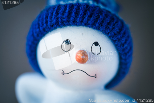 Image of Cute Snowman on Wooden Table