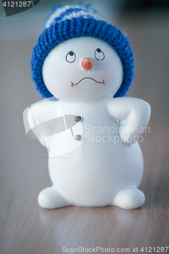 Image of Cute Snowman on Wooden Table